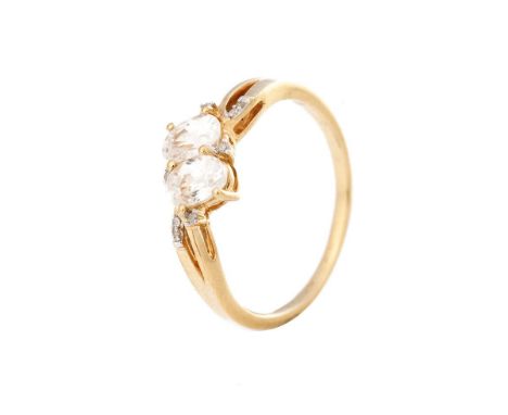 10ct gold ladies ring set with illusion set diamonds and larger white stones, 2.7 grams, size T.  