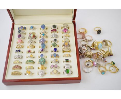 An good collection of over 75 sterling silver gemset ring to include various styles and sizes, some gold plated, in presentat