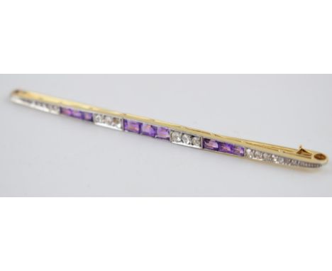 18ct gold and platinum Art Deco brooch set with alternating amethysts and rose cut diamonds, 8.2 grams, 10cm wide.  Pin a tad