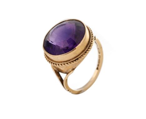 9ct gold ring set with circular purple stone, 5.2 grams, size M.  