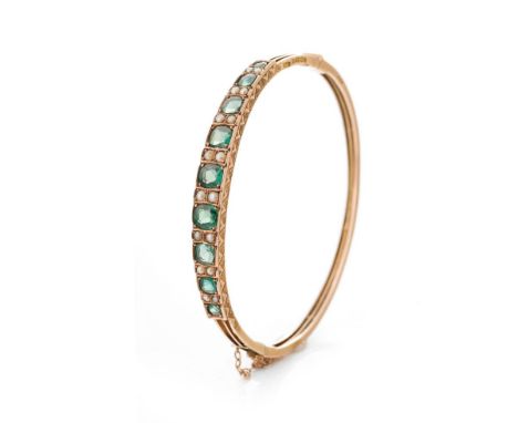 Victorian 9ct gold green tourmaline and pearl bangle, Birmingham 1895, with safety chain, 8.7 grams.  