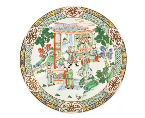 A Chinese Porcelain Charger, 19th century, painted in famille verte enamels with the Emperor and attendants in a garden lands