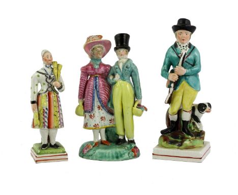 A Pearlware Figure, circa 1820, modelled as Madame Vestris as the Broom Girl15cm highA Similar Group of the Dandys17.5cm high