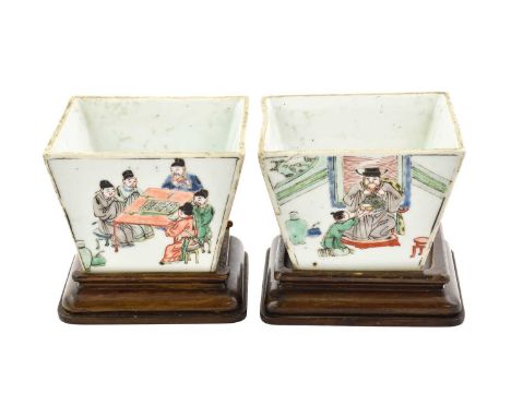 A Pair of Chinese Porcelain Cache Pots, in Kangxi style, of flared square form, painted in famille verte enamels with figures