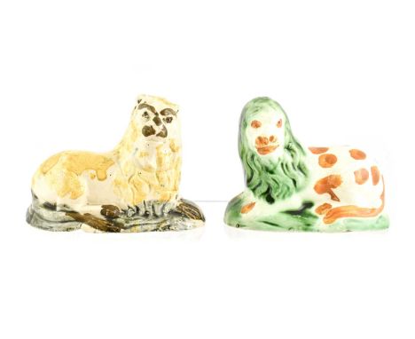 A Prattware Model of a Lion, circa 1790, recumbent on a mound base9.5cm longA Similar Lion8.5cm long (2)Spotted lion - chips 