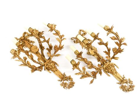 A Pair of Gilt Metal Five-Light Wall Sconces, in Louis XVI style, with leaf-sheathed sockets and scrolling branches, the ribb