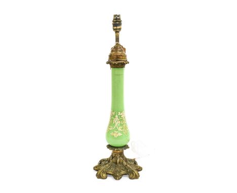 A Gilt Metal Mounted Green Glass Lamp Base, late 19th century, with leaf-sheathed capital, the slender baluster column with w