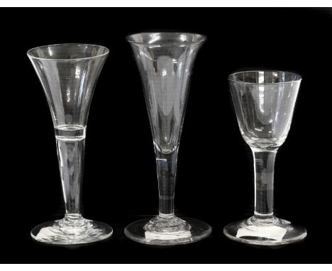 A Wine Glass, circa 1740, the drawn trumpet bowl on a hollow plain stem and circular foot15.5cm highA Similar Wine Glass, the