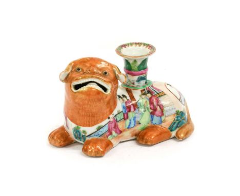 A Cantonese Porcelain Lion Dog Candlestick, late 19th century, typically modelled and painted with figures in a garden18cm lo
