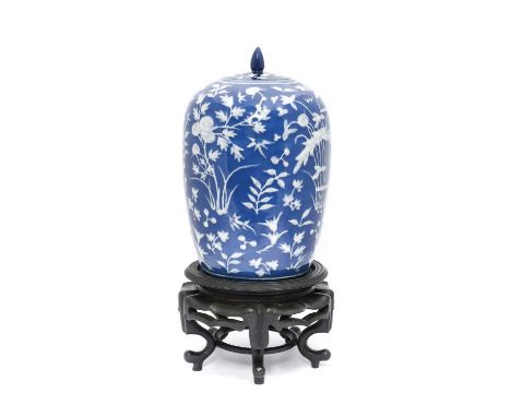 A Chinese High-Shouldered Jar and Cover, 19th century, painted in white enamel with foliage on a blue ground34cm highMinor ri