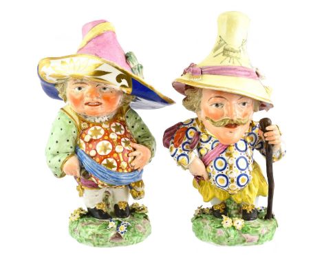 A Pair of Derby Porcelain Mansion House Dwarves, circa 1820, of traditional form, on mound bases, incised No27, 18cm highSome