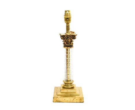 A Gilt Metal Mounted Glass Table Lamp, early 20th century, in the form of a Corinthian column on a stepped square base, fitte