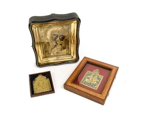A Balkan Icon, probably Romanian, 19th century, depicting the Virgin and Child half length, with gilt metal oclad22cm by 18cm