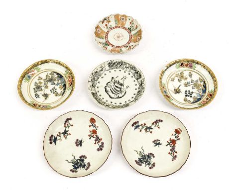 A Pair of Chinese Porcelain Saucers, circa 1730, painted in Kakiemon style with scattered sprigs under brown line rimsA Pair 