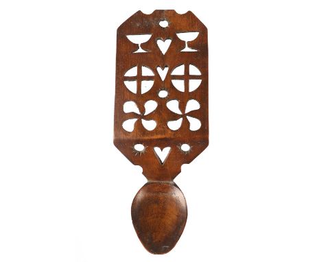 A Welsh Treen Love Spoon, early 19th century, the broad handle pierced with goblets, hearts, stars and geometric motifs19.5cm