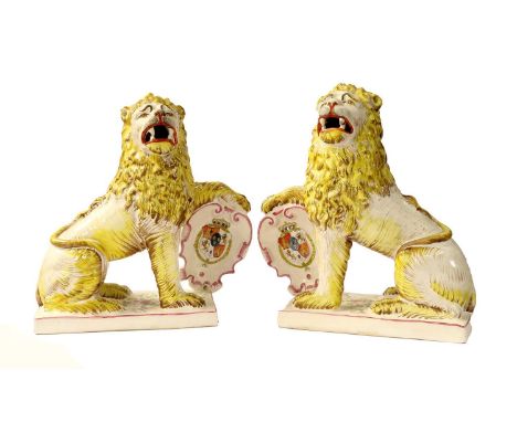 A Pair of French Faience Heraldic Lions, probably Rouan, late 19th century, the naturalistically modelled and painted beasts 