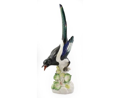 A Meissen Porcelain Model of a Magpie, 20th century, naturalistically modelled and painted on a tree stump applied with leave