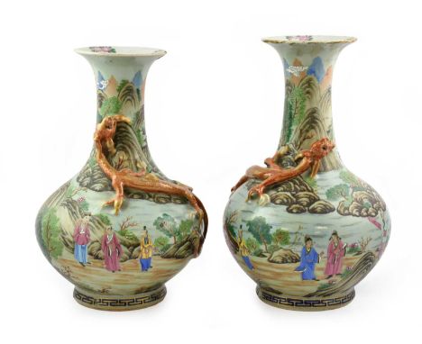 A Near Pair of Chinese Porcelain Celadon Ground Vases, 19th century, of ovoid form with trumpet necks applied with mythical b