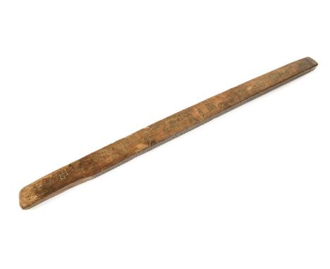 An 18th Century Scandinavian Fruitwood Calendar Stick (Primstav), possibly Norwegian, of rectangular section, the edges carve