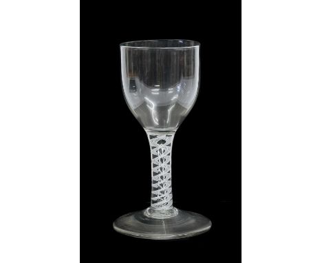 A Mixed Twist Wine Glass, circa 1750, to ovoid bowl on an opaque twist stem with central air tear17.5cm highLight wear and sc