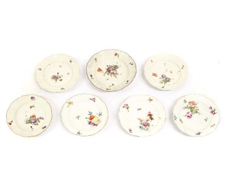 A Pair of Meissen Porcelain Dinner Plates, circa 1765, painted with flower sprays within ozier borders, painted marks in unde