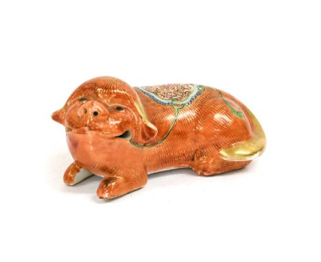 A Cantonese Porcelain Figure of a Lion Dog, 19th century, modelled recumbent with rouge de fer markings14cm longSome gilt wea