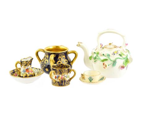 A Minton Porcelain Miniature Teapot and Cover, circa 1840, encrusted with naturalistically modelled and painted flowers, bear