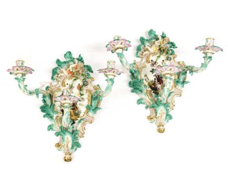 A Pair of Meissen-Style Porcelain Three-Light Wall Sconces, circa 1900, of scroll moulded form, painted with 18th century fig