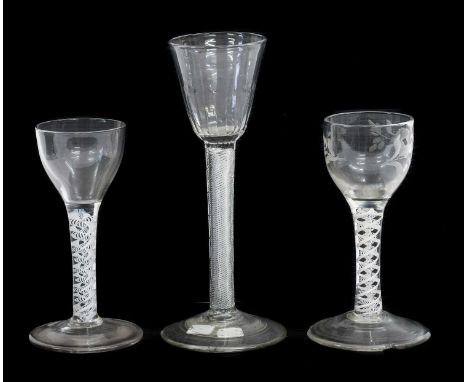 A Wine Glass, circa 1750, the semi-fluted rounded funnel bowl on an air twist stem17.5cm highA Similar Wine Glass, the rounde