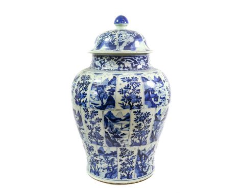 A Chinese Porcelain Jar and Cover, Kangxi, of baluster form, painted in underglaze blue with bands of panels of foliage and l