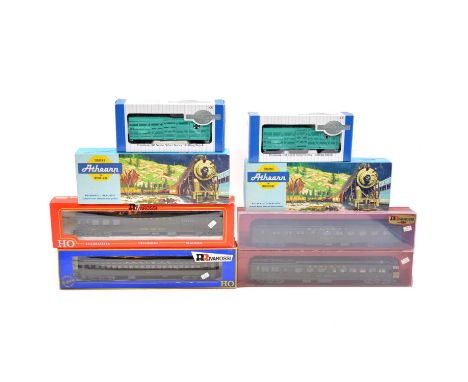 Nine HO gauge model railway passenger coaches and freight cars, including Rivarossi, Arthearn, Bachmann, and others, some box