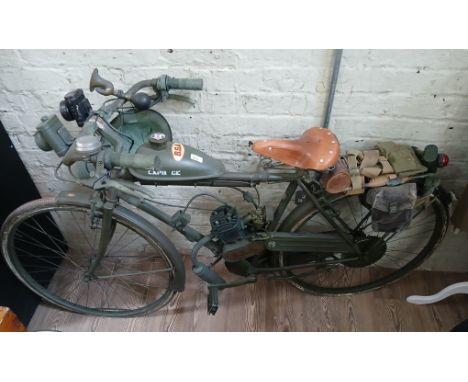 A military style pedal and pop motorcycle, painted in BSA colours and bearing logo, fitted with accessories.