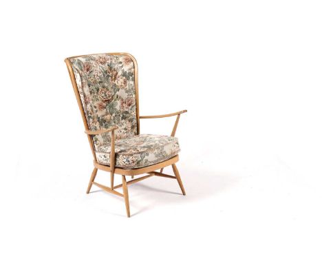 Lucien Ercolani for Ercol - Model 913: A retro beech and elm highback easychair, the curved headrest over a spindle backrest,