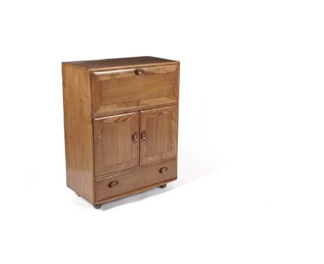 Lucien Ercolani for Ercol - Model 469: A retro light elm portable drinks cabinet/bureau, the fall front top cabinet enclosing