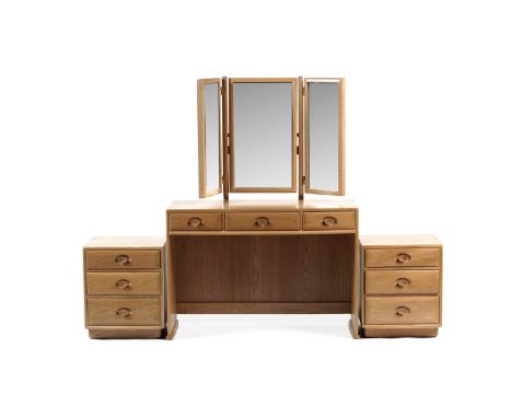 Ercol: A late 20th Century beech and elm bedroom suite comprising: a dressing table with triptych mirror, 110 x 44 x 151cm hi