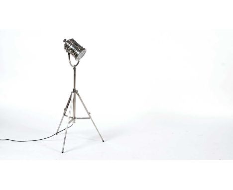 Fancy: A modern chrome spotlight lamp, with adjustable light raised on a tripod base, 90cm high.