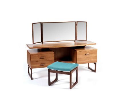 G Plan - Quadrille: A retro teak dressing table, the hinged triptych mirror over a floating shelf with central kneehole, flan