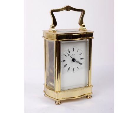 A brass and bevelled glass cased carriage clock, face marked Henley on  white enamel with Roman numerals AF