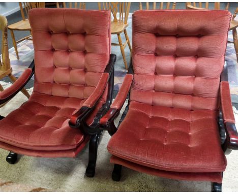 A pair of 20th century pink upholstered button back Show wood arm chairs. 