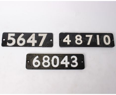 Three cast iron engine plaques from steam locomotives. Numbers: 5647, 48710 and 68043.