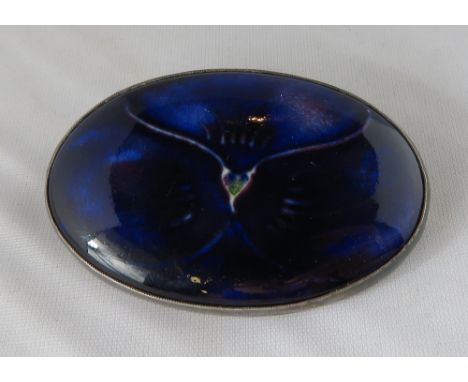 A Liberty & Co Moorcroft ceramic set silver brooch, Birmingham 1917, the oval ceramic panel with vague green signature to the