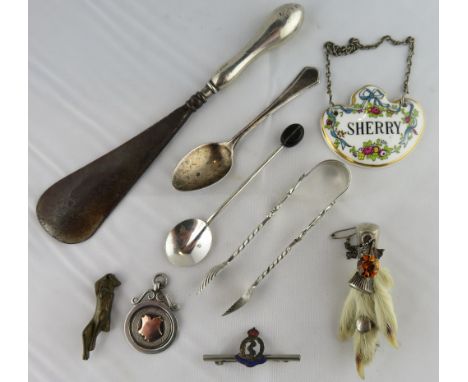 A silver bean end coffee spoon; a silver tea spoon; a pair of late Victorian silver sugar tongs; a shoe horn with a loaded si