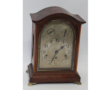 An early 20th century German, three train bracket style mantel lock with Westminster chimes strike, contained within a mahoga