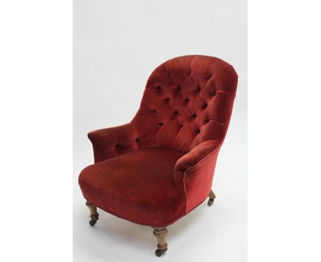 An Edwardian button back chair, with turned legs 