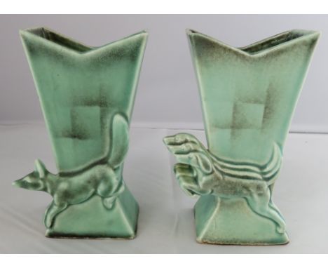 A pair of Goebel Art Deco green glazed vases, one decorated with a fox and the other with hounds, crown mark to the base, 13c