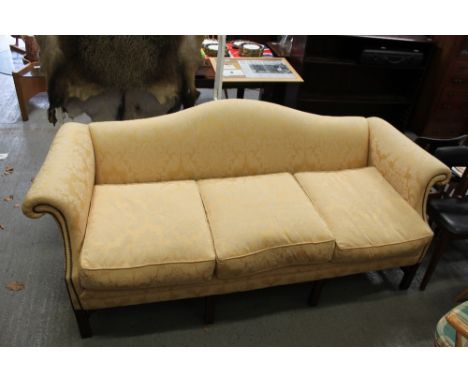 A large three seater sofa, with a shaped back and scroll arms, 82cm high, 184cm long, 85cm deep