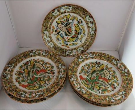 A collection of seven Chinese plates, each painted with butterflies, on gold and enamel background, 24.5cm diameter