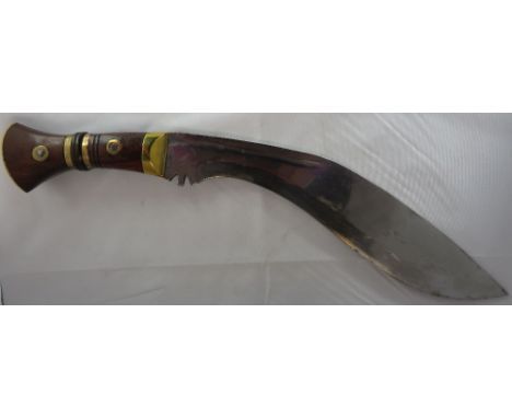 A military Kukri style knife, the blade stamped COI G II 1937 37" in original leather scabbard "