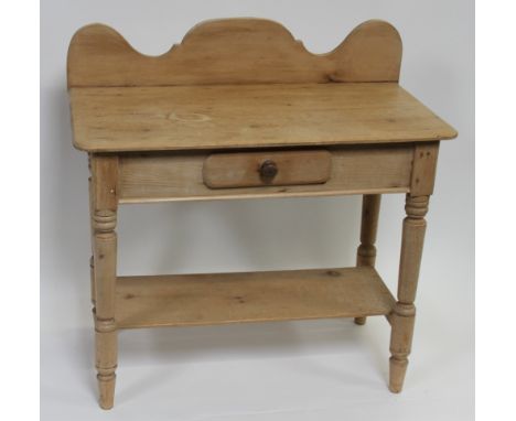 An early 20th century pine washstand, with single drawer and single shelf below, 92cm high, 91cm long, 42cm deep