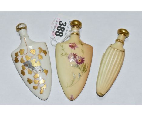 A GROUP OF THREE ROYAL WORCESTER PORCELAIN SCENT FLASKS, comprising a shield shaped bottle, hand painted decoration of a butt